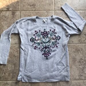 Gray sweater with hand sewn flower details. Beautiful!